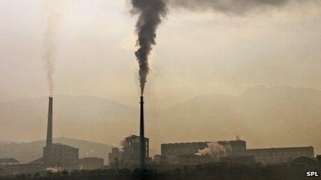 Smoke rising from factory chimneys