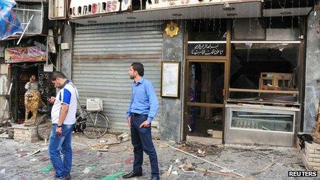 The site after bombs exploded close to a police post in the central Marjeh Square in Damascus