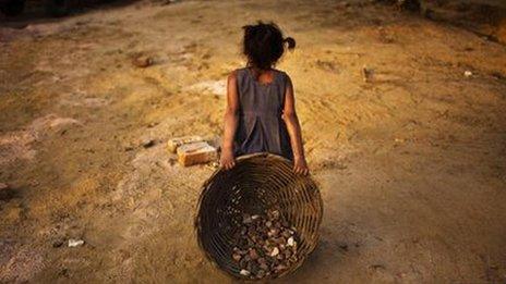 An Indian child working on a construction project