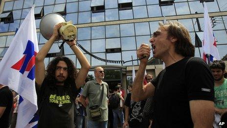 Workers protest outside ERT's headquarters in Athens (12 June 2013)