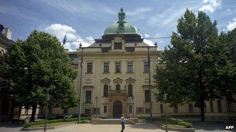 A policeman stands guard in front of the Czech government headquarters on June 13