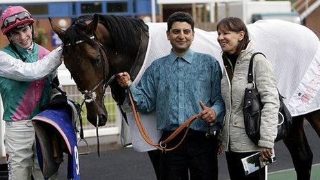 Jockey James Doyle (left), with stable hand and Lady Cecil