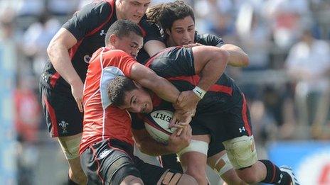 Andries Pretorius of Wales is tackled by Hendrik Tui of Japan