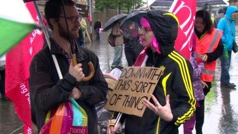 G8 protesters with sign