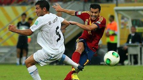 Spain's Pedro in action against Uruguay