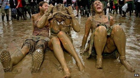 Mud-soaked festival goers at Glastonbury 2007