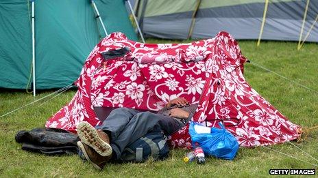 Person in a flowery tent