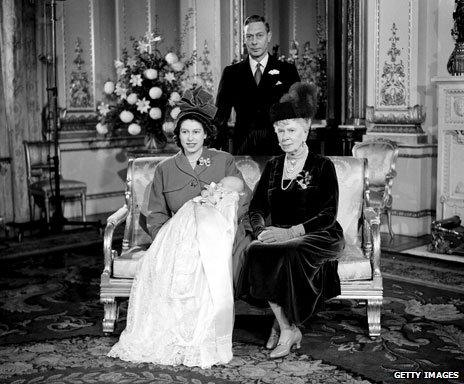 Elizabeth holding Charles in the christening robe