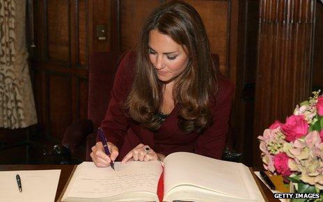 Duchess of Cambridge signing book