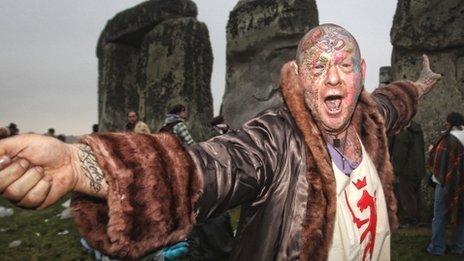 Crowds gather at dawn amongst the stones at Stonehenge in Wiltshire for the Summer Solstice