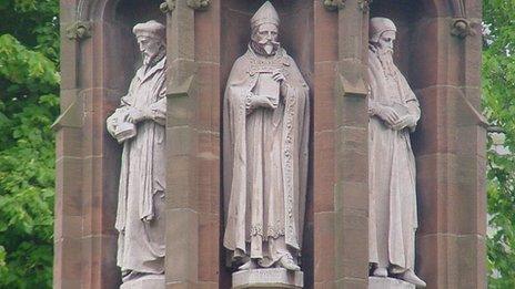 A monument to the translators of the Bible stands in the grounds of St Asaph Cathedral