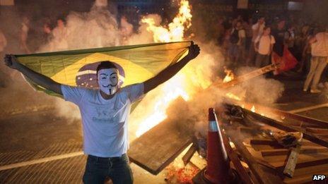 A masked Brazilian protester in Niteroi. Photo: 19 June 2013