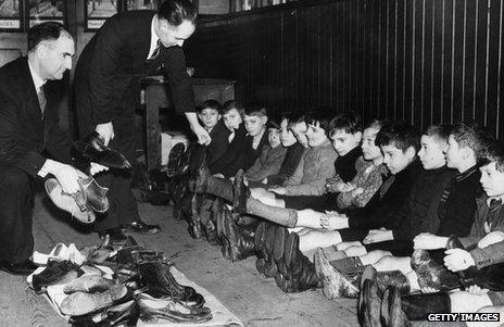 Shoes are handed out to children at Blaina Primary School