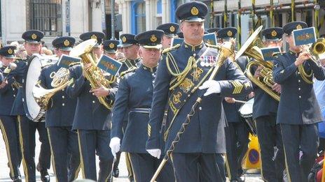 The RAF regiment band marching in the street