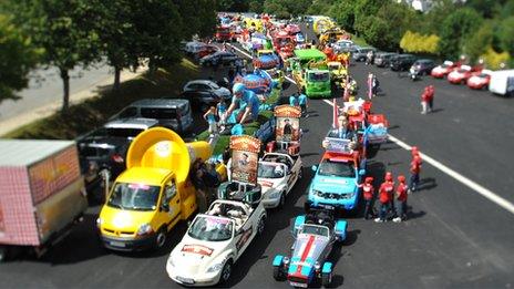 Sponsors' publicity vehicles lined up ready for the start of the tour