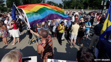 People celebrate outside the Supreme Court after two historic gay marriage rulings in Washington DC 26 June 2013