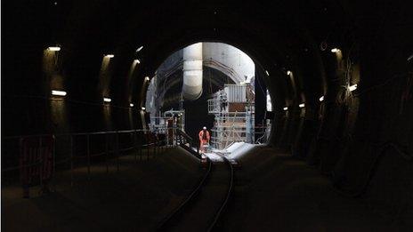 Construction worker standing in a Crossrail tunnel