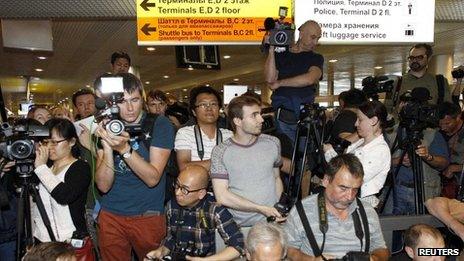 Journalists pursue Edward Snowden at Moscow's Sheremetyevo airport on 23 June