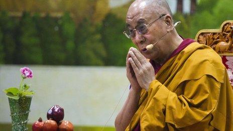 Tibetan spiritual leader the Dalai Lama prays during a talk to young Tibetans at the Tibetan Children"s Village School in Dharamsala, India, Thursday, June 27, 2013