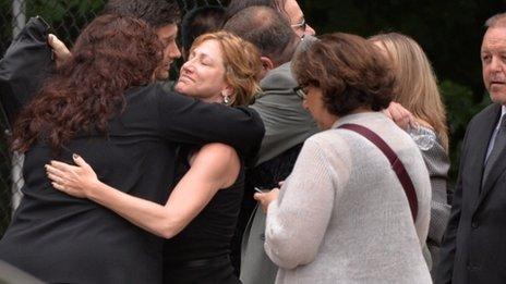 Edie Falco with mourners