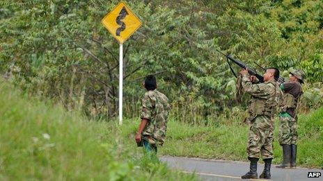 A Farc rebel takes aim in Cauca province, Colombia on 4 June 2013