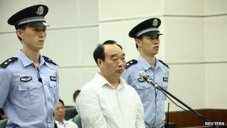 Lei Zhengfu attends his trial at a court in Chongqing municipality on 19 June 2013