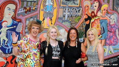 Grayson Perry, with three of the women featured in "Adoration of the Cage Fighters