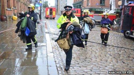 Fire and police officers with coats rescued from Almost Famous