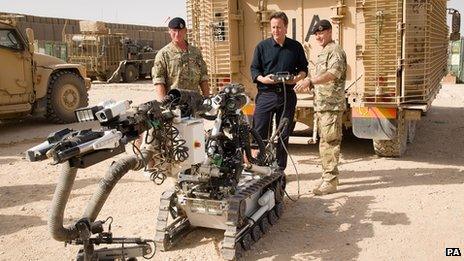 David Cameron controlling a robot at Camp Bastion