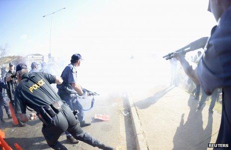 Riot police clash with protesters in Soweto, 29 June