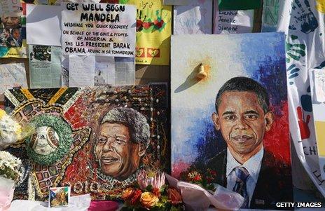 Portraits of Nelson Mandela (left) and Barack Obama outside the MediClinic Heart hospital in Pretoria, 29 June