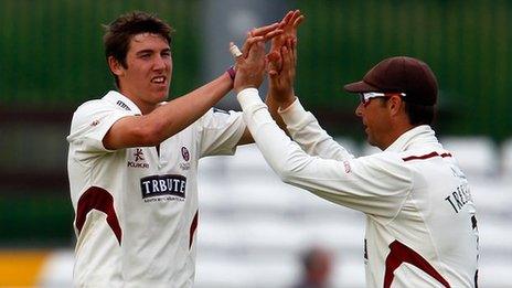 Jamie Overton celebrates with Somerset captain Marcus Trescothick after taking a wicket