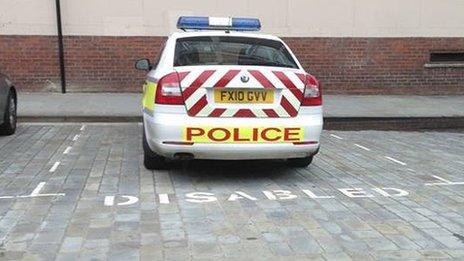 Police car in disabled bay