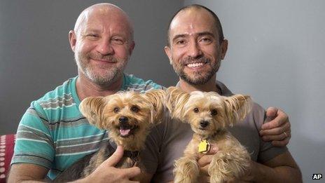 Julian Marsh, left, and Traian Popov and their Yorkshire Terriers at their home in Fort Lauderdale, Florida, on 1 July 2013