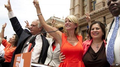 Wendy Davis (in red dress) outside the state Capitol in Austin, Texas 1 July 2013