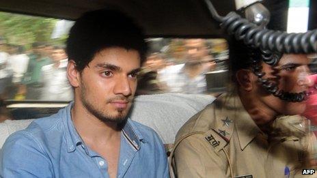 Indian actor Suraj Pancholi, boyfriend of the late Bollywood film actress Jiah Khan, sits inside a police vehicle on his way to a court in Mumbai on June 11, 2013