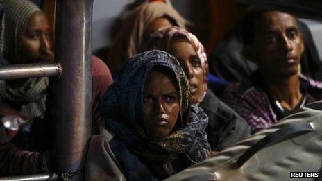 Migrants arrive in port in Malta after being rescued from a drifting boat, 4/7/2013