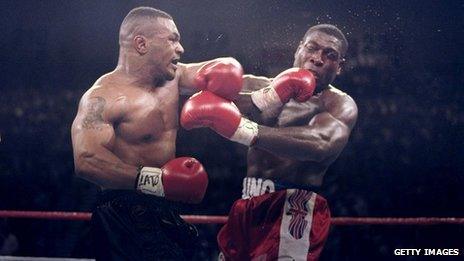 Mike Tyson lands a left punch on Frank Bruno at the WBC Heavyweight Championship on March 16, 1996