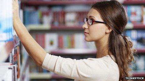 Woman looking at books