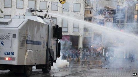 Turkish police fire a water cannon at protesters in Istanbul (8 July 2013)