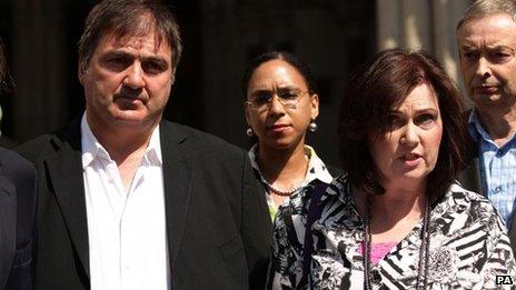 Michelle Diskin (second right) reads a statement on behalf of her brother Barry George (left), who spent eight years in prison after being wrongly convicted of the murder of TV presenter Jill Dando, outside the Royal Courts of Justice, London, where he lost his legal battle for compensation as a victim of a "miscarriage of justice" in the Court of Appeal