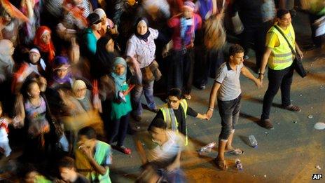 Male volunteers separate women from men in Tahrir Square on 5 July 2013