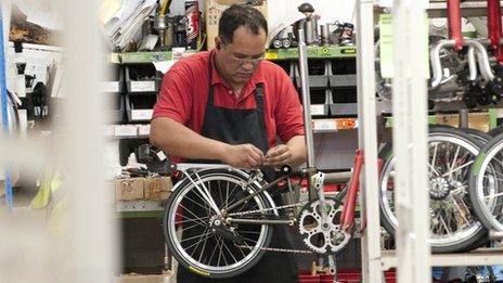 A Brompton being assembled by a worker at its Brentford factory