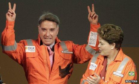 Brazilian billionaire Eike Batista (L), gestures next to Dilma Rousseff on 26 April