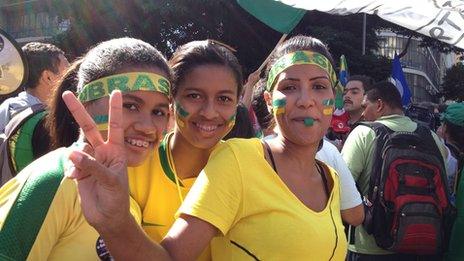 Three young women protesting in Rio in June 2013