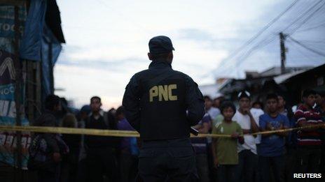 Police officer in Gutemala City, 26 June 13