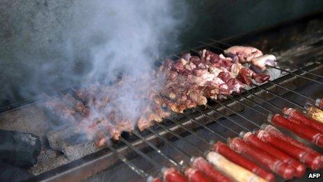 Lamb chuanr, or lamb kebabs, are roasted in a restaurant in Shanghai on 7 May 2013