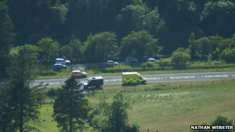 Military and emergency vehicles at the scene of the deaths in the Brecon Beacons