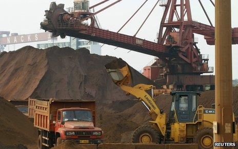 Truck being loaded with iron ore at Nantong harbour