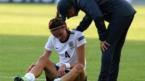 England coach Hope Powell comforts player Jill Scott after the Uefa Women's Euro 2013 Group C match between England and Russia at Linkoping Arena